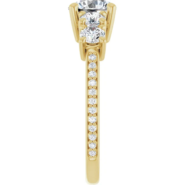 Round diamond five-stone ring with sparkling side and accent stones.