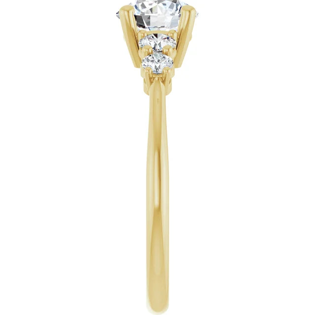 five-stone diamond ring with claw prongs and polished gold band set in yellow gold showing shank from the side