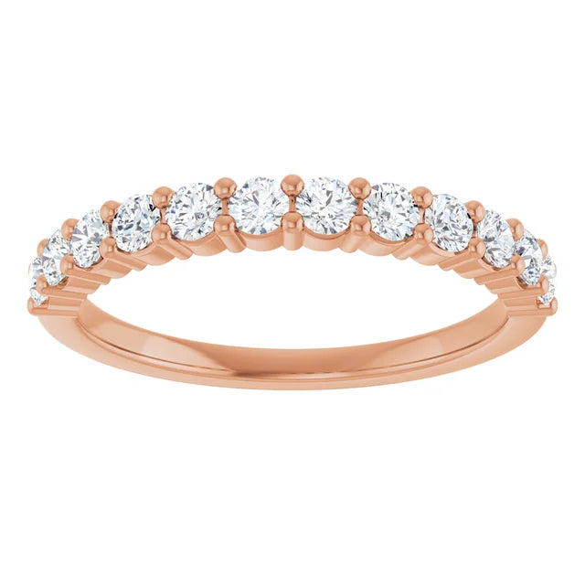 Rose gold ring with diamonds on a white background