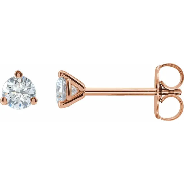 Rose gold diamond stud earrings on a white background