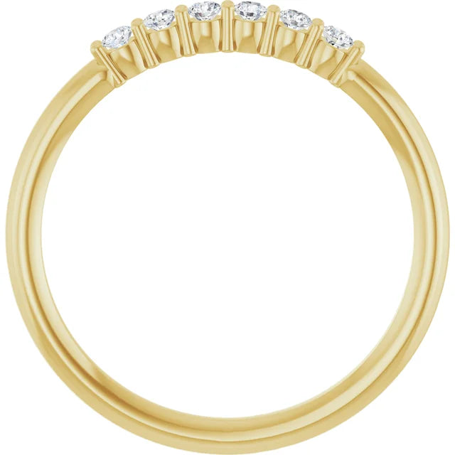 Gold ring with small diamonds on a white background