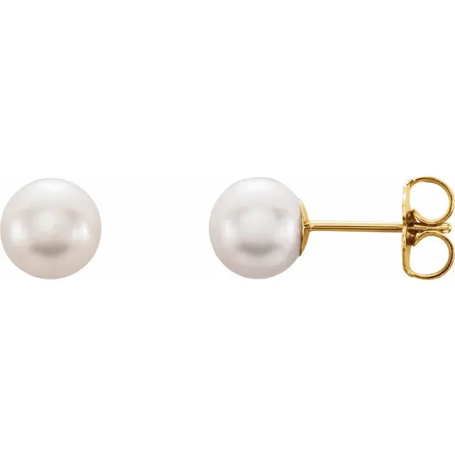 pair of 14K Yellow gold white cultured freshwater pearl stud earrings near round shape with soft luster