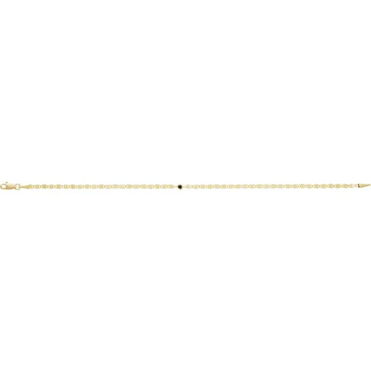 Close-up of black diamond bezel link bracelet in 14K yellow gold
