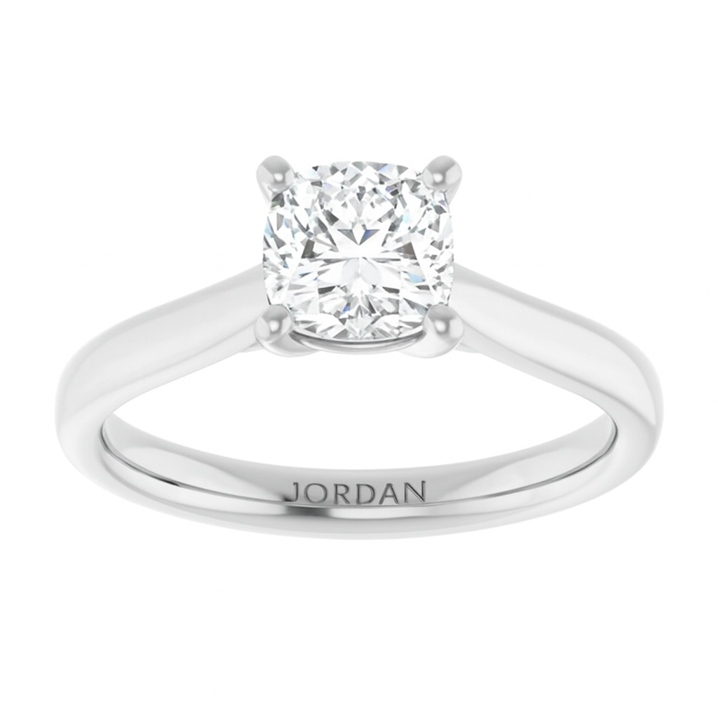 Classic 4-prong cushion cut solitaire engagement ring in 14K white gold with a 1 carat diamond, soft square shape with rounded edges.
