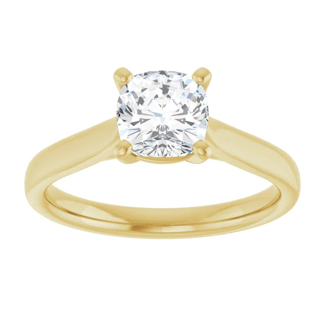 Classic 4-prong cushion cut solitaire engagement ring in 14K Yellow gold with a 1 carat diamond, soft square shape with rounded edges.