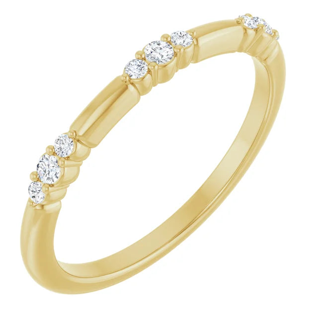 Gold ring with diamonds on a white background