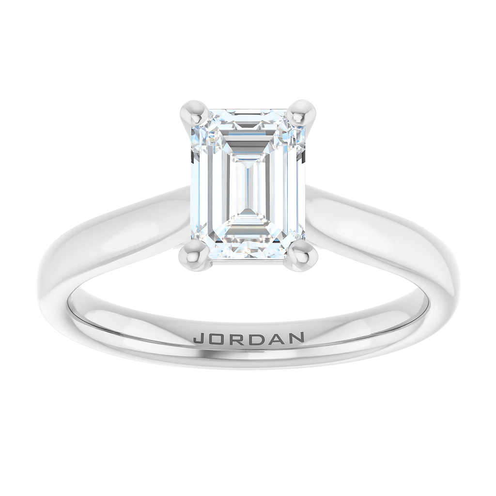 Classic 4-prong emerald cut solitaire engagement ring in 14K white gold with a 1 carat diamond, elegant step-cut rectangular design