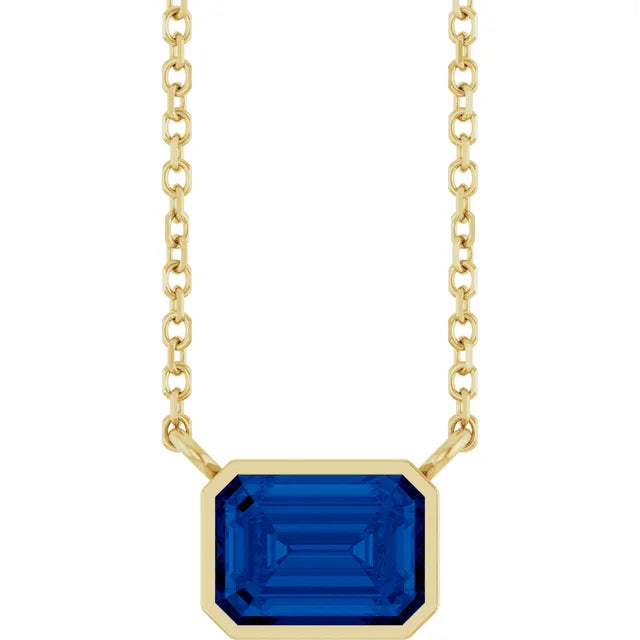 Yellow Gold Bezel Set Emerald Cut Blue Sapphire Birthstone Solitaire Necklace