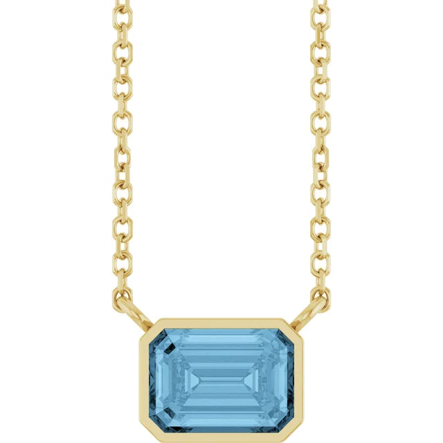 Yellow Gold Bezel Set Emerald Cut Sky Blue Topaz Birthstone Solitaire Necklace