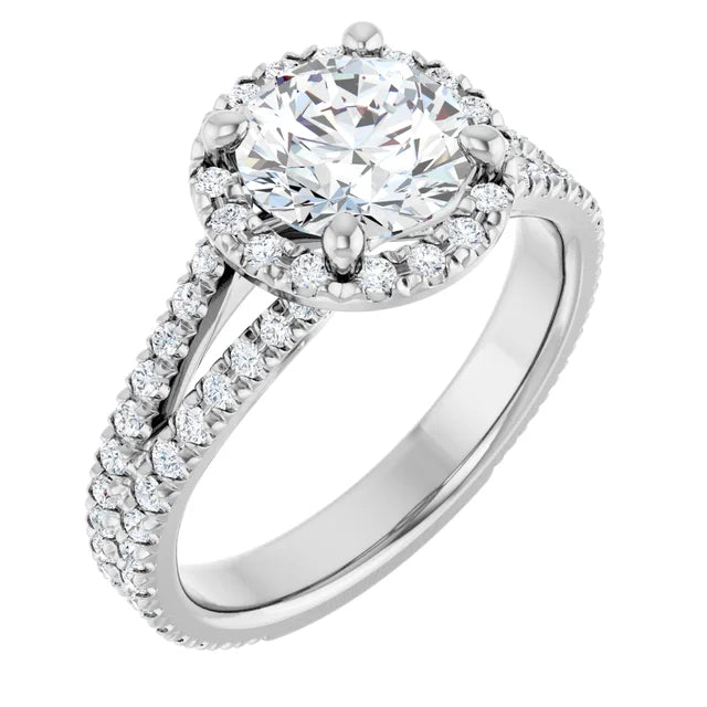 Round diamond engagement ring with French-set accents and a split shank band in White gold
