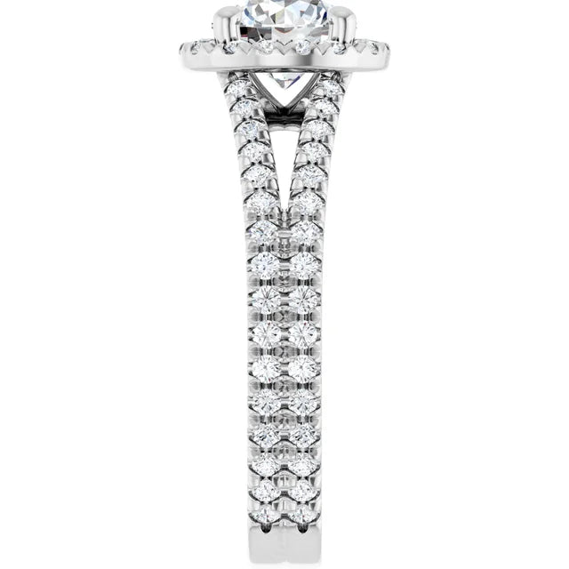 Round diamond engagement ring with French-set accents and a split shank band set in white gold showing diamond on the shank