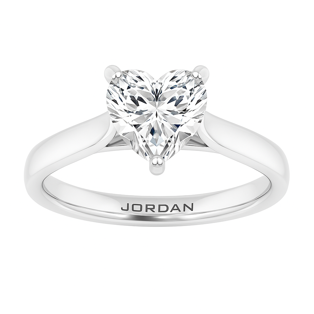 Heart-shaped solitaire engagement ring in 14K white gold with a 1 carat diamond, featuring a three-prong setting and engraved ‘JORDAN’ logo on the shank.