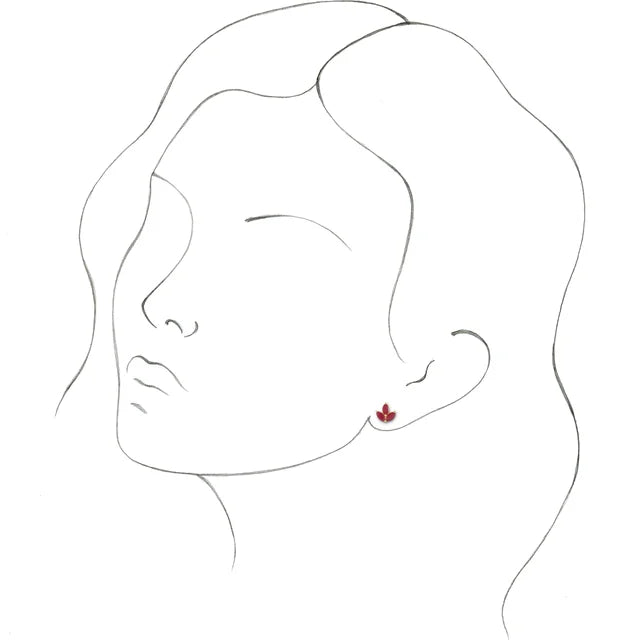 a model wearing ruby cluster stud earrings