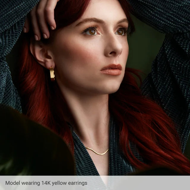 model wearing 14K Yellow Hoop Earring 