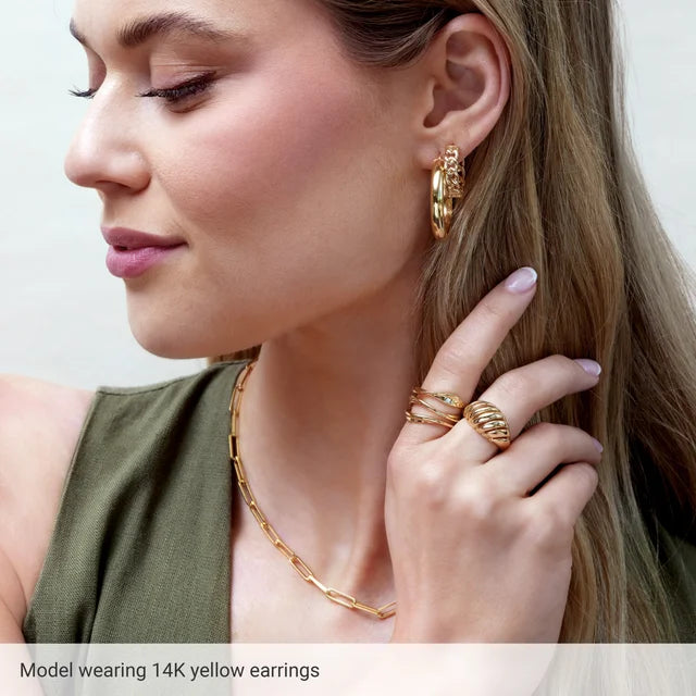 a Model wearing 14K Gold Tube hoop earrings 