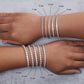 a picture showing Diamond tennis Bracelets Sizes in models hands 