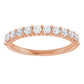 Rose gold ring with diamonds on a white background