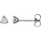 Pair of diamond stud earrings on a white background