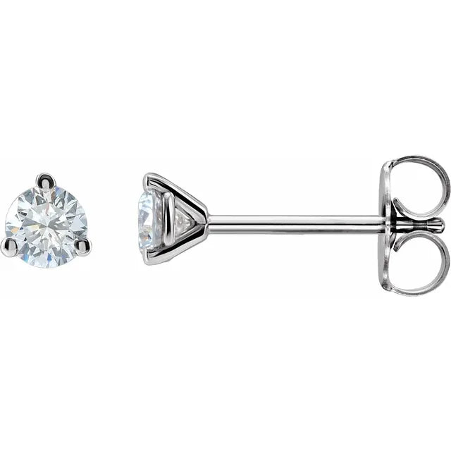 Pair of diamond stud earrings on a white background