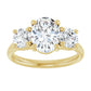 2 1/2 CTW 3-Stone oval center stone and two round stones on the Side 