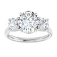 2 1/2 CTW 3-Stone oval center stone and two round stones on the Side set in white gold or platinum