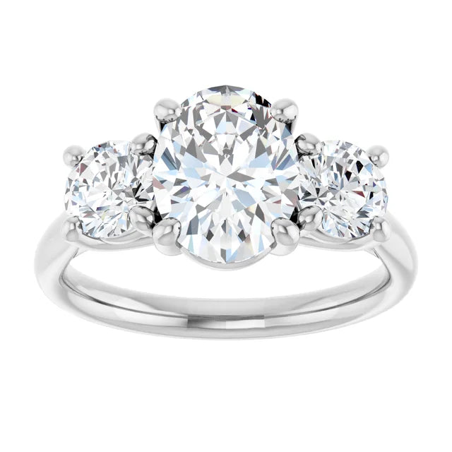 2 1/2 CTW 3-Stone oval center stone and two round stones on the Side set in white gold or platinum