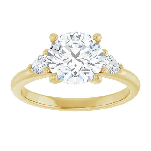 2 1/4 CTW Three-stone diamond engagement ring with round center and pear-shaped side stones 