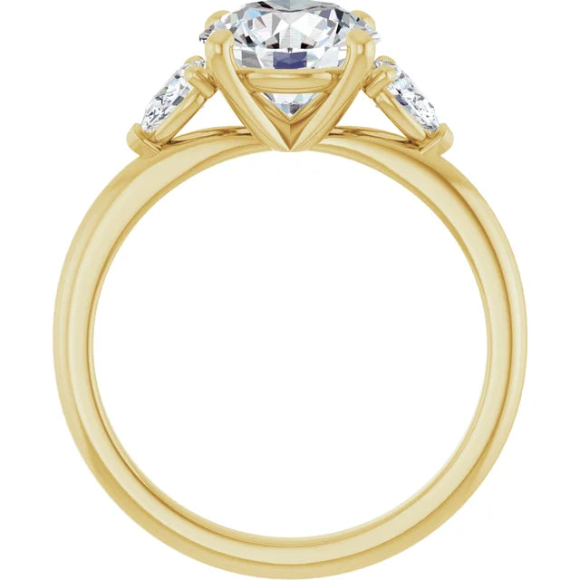 2 1/4 CTW Three-stone diamond engagement ring with round center and pear-shaped side stones in Yellow gold showing under gallery 