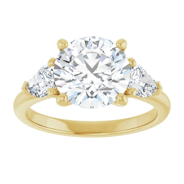 3 1/4 CTW Three-stone diamond engagement ring with round center and pear-shaped side stones
