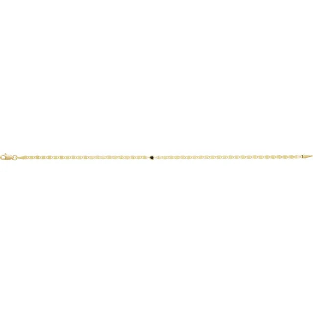 Close-up of black diamond bezel link bracelet in 14K yellow gold