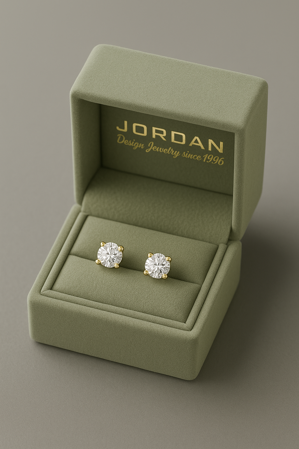 Classic 4-prong round diamond stud earrings presented in branded gift box — ready to gift
