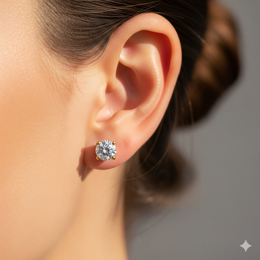 On-ear view of classic 4-prong round diamond stud, ~0.5 ct each (1 ct tw), 14K yellow gold