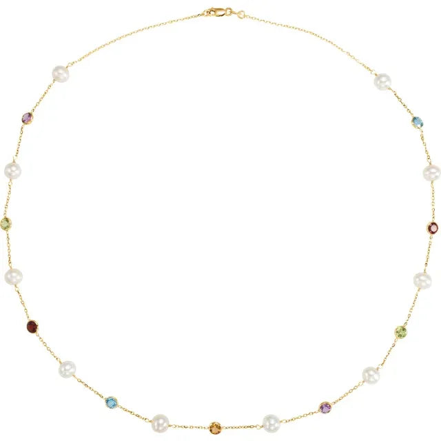 Multi-gemstone and freshwater pearl station necklace in 14K yellow gold with colorful gemstone accents