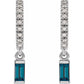 Pair of earrings with blue gemstones and diamond-studded hoop designs on a white background