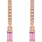 Rose gold earrings with pink gemstones on a white background