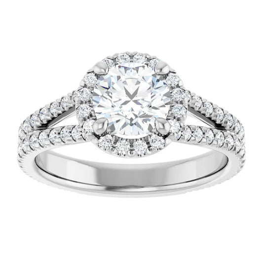 Round diamond engagement ring with French-set accents and a split shank band set in Platinum 