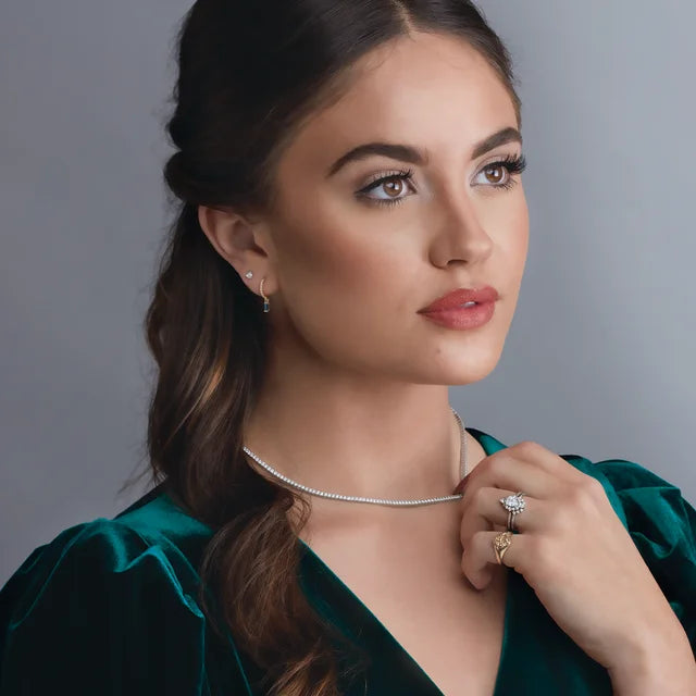 a model wearing a diamond necklace 