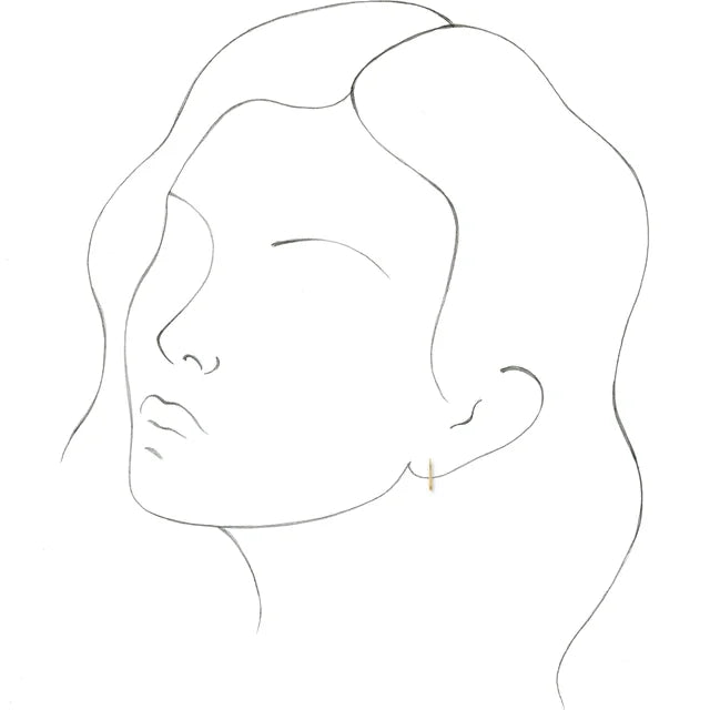 Model wearing 14k Gold Hoop Earrings yellow gold 10 MM