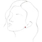 a model wearing ruby cluster stud earrings 